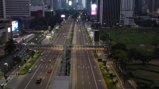 Aerial drone footage of the highway within the central city of Jakarta Indonesia at night