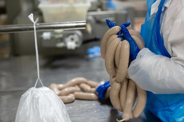 Hand holding sausages