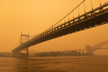 The Triborough Bridge along the East River in New York City with Massive Air Pollution from...