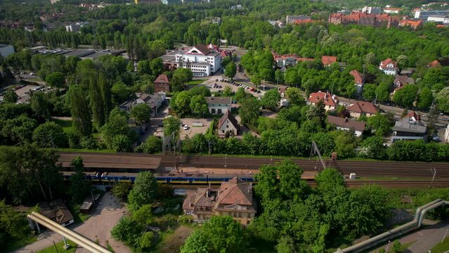 Aerial view of tram or tram riding in city of Gdańsk during sunny day, Poland