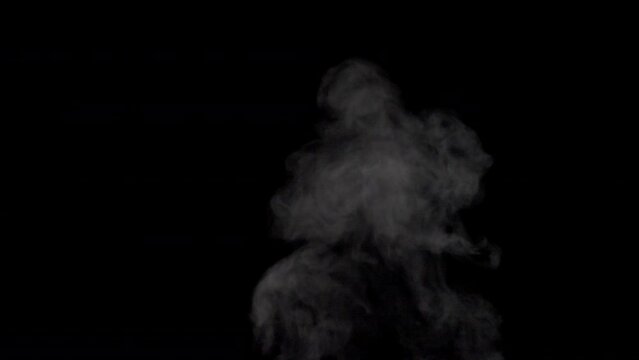 White smoke,steam on a black background.
Slow motion. Shot in 4K resolution at 120fps.
