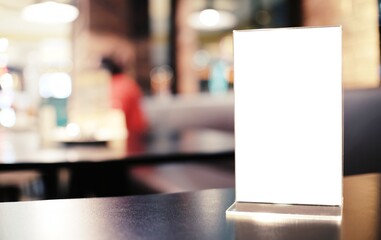 Menu frame standing on wood table in Bar restaurant cafe. space for text marketing promotion.