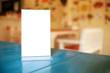 Menu frame space for text marketing promotion standing on wood table in Bar restaurant cafe.
