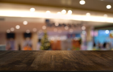 Empty wood table top and blur of night market background/selective focus .For montage product display.