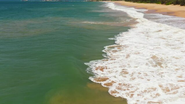 Sandy beach and turquoise water.Lankavatara, Sri Lanka.