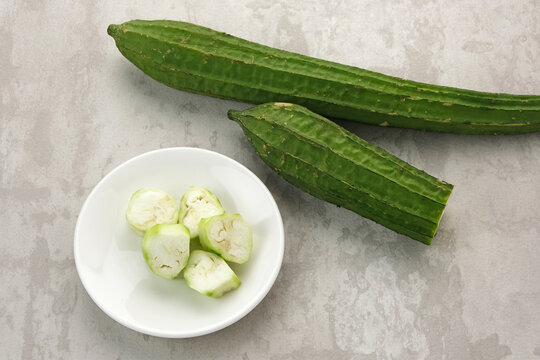 Oyong or Angled luffa (luffa acutangula on white board
