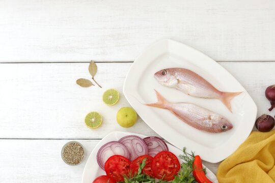 Sultan ibrahim fish,red fish,  fresh seafood, on the table, white background