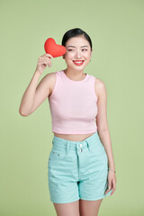 Asian woman with red heart on white background