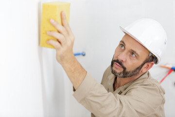 a man working on wall