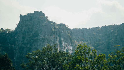 Green fields with luxurious mountain in the background, Thakhek loop, Laos