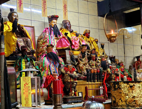 Chinese gods and other statues on an altar at shrine (Chinese temple), Ranong, Thailand, May 25, 2023