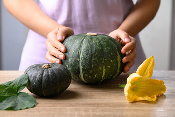 Green pumpkin with hand prepare for cooking