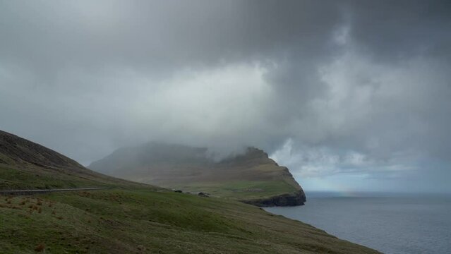 Cape Enniberg With Thick Clouds On Top In The Island of Vidoy, Faroe Island, Denmark. Timelapse
