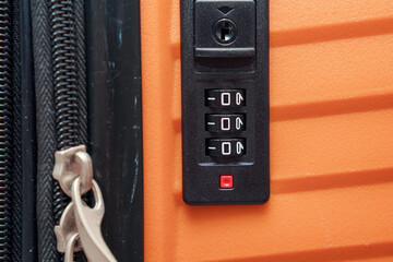 Detail of bright suitcase with combination lock password number 000. Transportation protect and...
