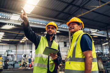 Workers Factory or Engineering work at factory site check up machine or products in site. Foreman or Technician checking Material or Machine on Plant. Heavy industry factory concept.