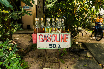 Gas bottle (gasoline) sold on the border of the road in Koh Tao island, Thailand