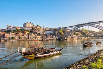Porto Portugal, city skyline at Porto Ribeira and Douro River with Rabelo wine boat - obrazy, fototapety, plakaty