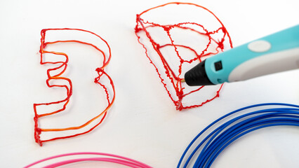 the boy draws with a 3d pen. the concept of additional education