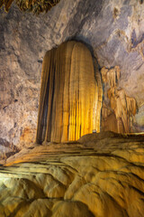 Big cave and stalactite looking like a sculupture in Paradise Cave in Phong Nha (Ke Bang), Vietnam.