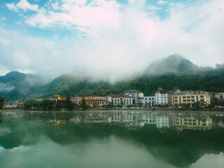 View on Sa Pa lake and the mountains, during a foggy weather, Vietnam.
