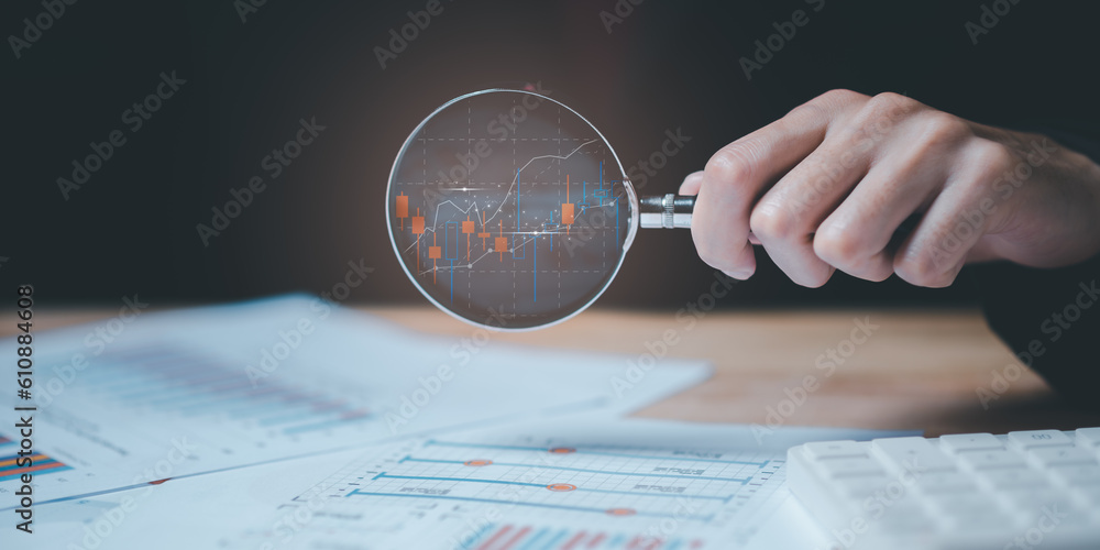 Fototapete statistical analyst using calculator to calculate and read reports, graphs and charts, business stat