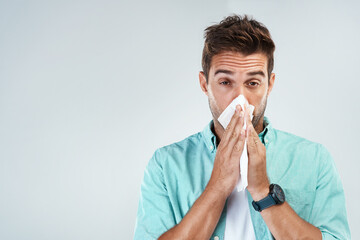Wipe nose, tissue and portrait of man in studio with flu allergy, sickness and virus on white background. Handkerchief, mockup space and face of male person for hayfever, cold and sneeze for sinus - obrazy, fototapety, plakaty
