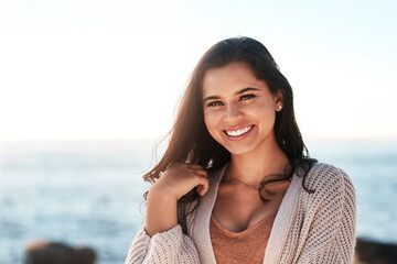 Beach portrait, happy and woman relax for outdoor wellness, nature freedom and smile for vacation peace. Ocean sea water, summer happiness and face of female person on travel holiday in Argentina