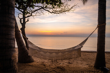 Beachfront sunrise with pool and palm trees in Hua Hin, Prachuap Khiri Khan, Thailand