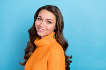Photo of pretty girly lady wear knitted pullover smiling empty space isolated blue color background