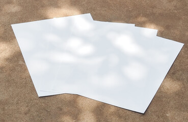 White paper mock-ups isolated on Concrete wall background, Blank portrait paper A4. brochure...