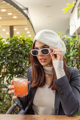 Fototapeta premium Beautiful woman looking over sunglasses