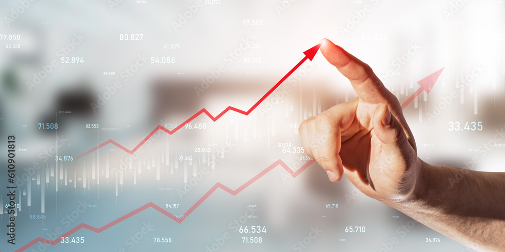 Poster Financial goal and sales targeting concept with a businessman finger pressing a button on a virtual forex chart with upward arrow on a digital display hologram, on a blurred office background