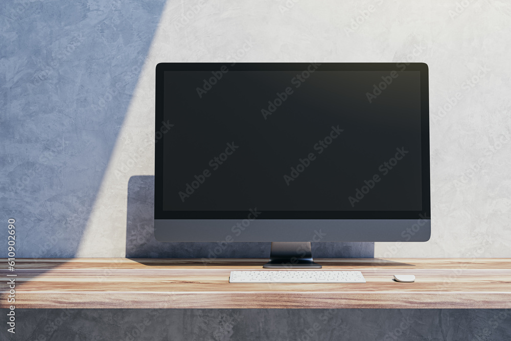 Poster Close up of empty mock up computer display on wooden desktop and concrete wall background with shadow. Designer desktop and ad concept. 3D Rendering.