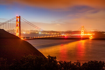The fabulous Golden Gate Bridge at sunrise as seen from a viewpoint on the bridge. The fabulous...