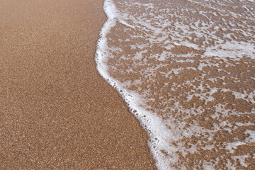 Sand and sea wave. Summer beach
