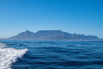 scenic view of cape town with ocean and waves in foreground