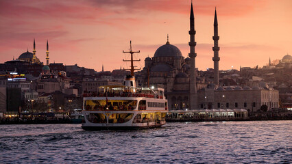 15th of March, 2023, Turkey, Istanbul. Ferry boat floating in Bosphorus at sunset. 15th of March, 2023, Turkey, Istanbul.