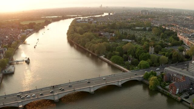 Aerial shot over Putney bridge towards Fulham palace