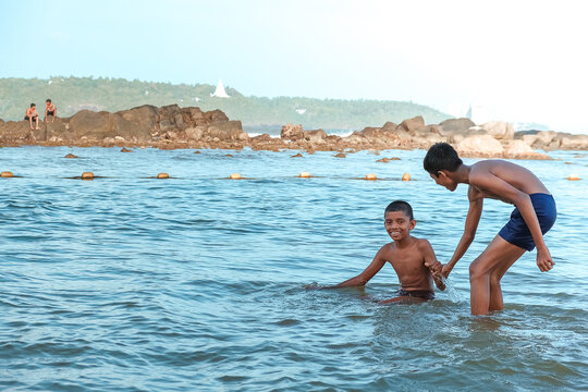 Asian American Friends Swim Having Fun In The Ocean, Sea. Friendship, National Culture,aapi People,asian Culture,freedom,juneteenth Day,diversity Gen Z