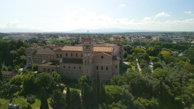 Cinematic Orbiting Shot Above Basilica of Saint Bonifacio and Alessio in Rome, Italy. Campanile