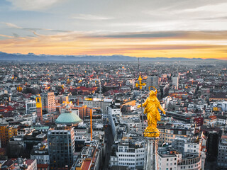 Aerial View The Madonnina, statue of the Virgin Mary on top of Milan Cathedral (Duomo di Milano) in Milan city. Statue was erected in 1762, it was designed by Francesco Croce - obrazy, fototapety, plakaty