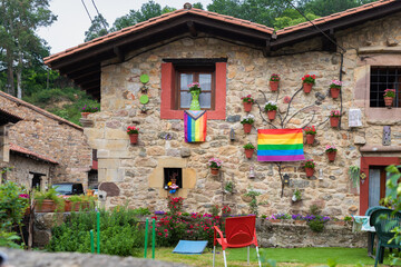 World Pride 2023. Pride day. LGBTQIA+ community flag. Pride flag on a house facade