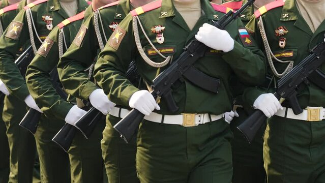 9 may russian war parade. A lot of men soldiers hold ak 47 rifle close up. Russia armed forces. Ukrainian military conflict. Army invasion. Kalashnikov ak47 weapon. Ukraine crisis. Warfare machine gun
