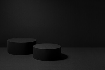 Abstract black stage with two round podiums mockup for presentation cosmetic products, goods,...