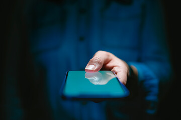 Close Up Of Woman Using Mobile Phone Using Biometrics To Unlock Device