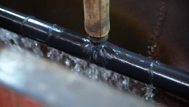Tube manufacturing plant. Metal plant. Tube expansion. Tap. Factory. Machine tools. Production. Heavy industry.
