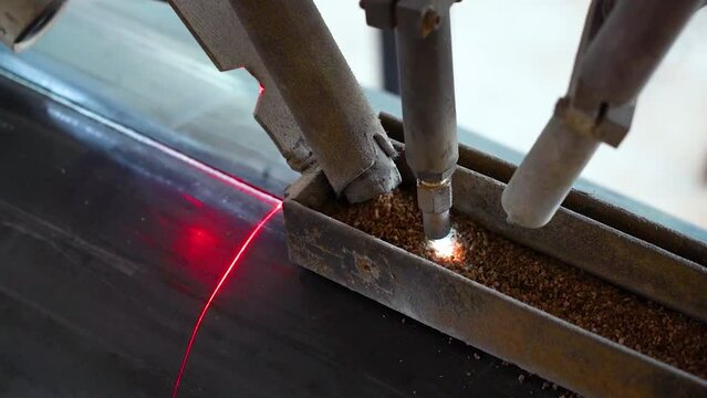 Pipe manufacturing plant. Pipe plant. Iron pipe welding. Pipe expansion. Sparks of welding. Tap. Factory. Machine tools. Production. Heavy industry.