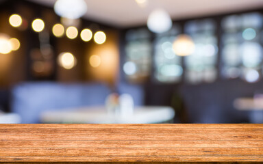 wooden board empty table in abstract blurred cafe background