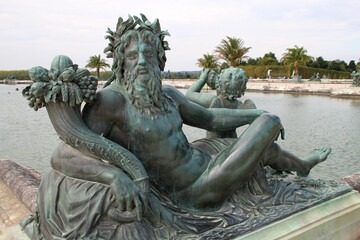 allegorical statue of the river loire at the castle of versailles (france)