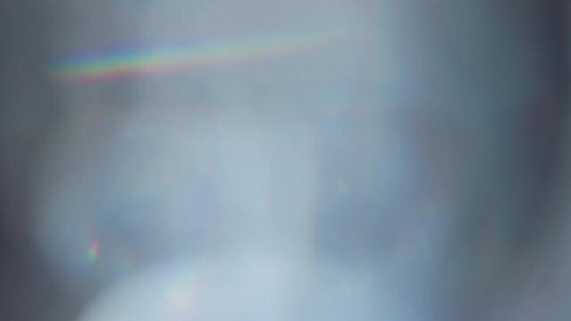Solar Flare in a Thick Prism. Loop. An optical lens system creates a series of bright, changing geometric highlights through the thickness of the glass